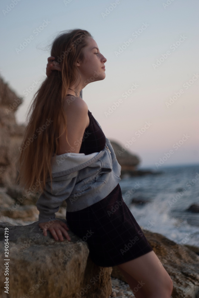beautiful young blonde with long flowing hair and blue eyes on the beach beautiful young blonde with long flowing hair and blue eyes on the beach