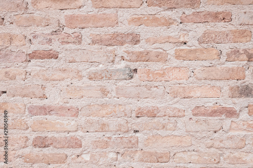 Old grunge brown stone brick wall texture abstract background.