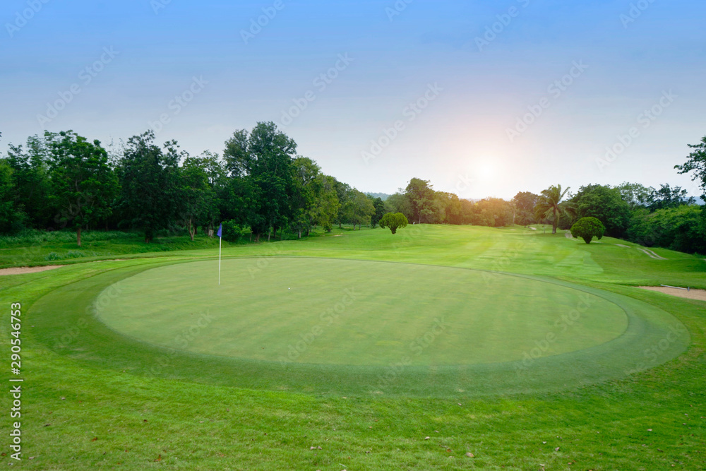 The evening golf course has sunlight shining down at golf course in Thailand The evening golf course has sunlight shining down at golf course in Thailand