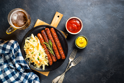 Sausage, sauerkraut, bretzels and beer. photo