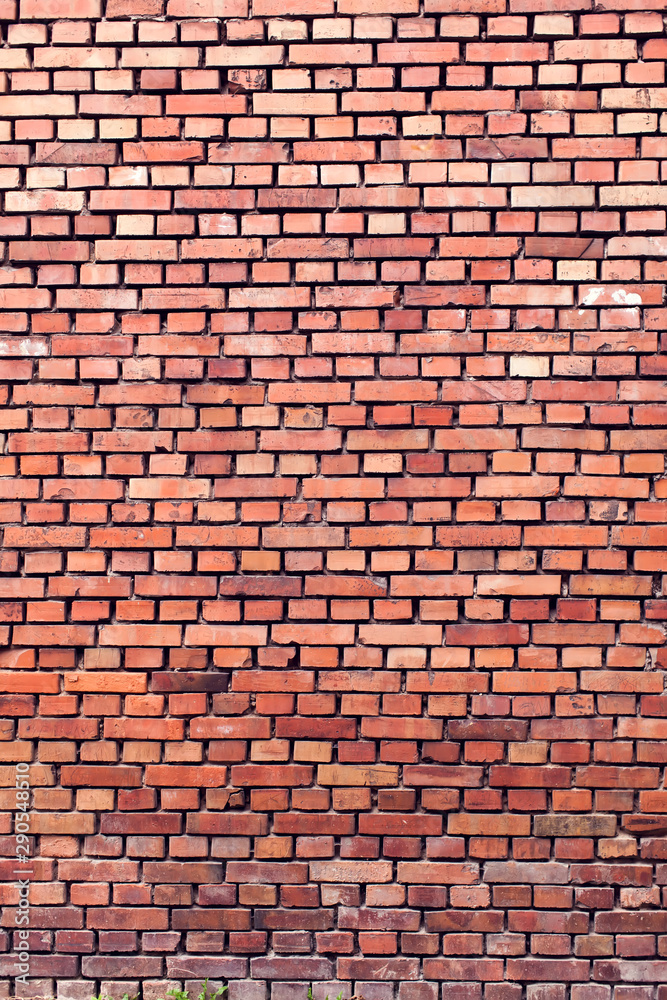 Obraz premium Red bricks background. A part of wall of the building