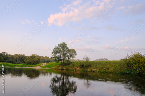 Summer landscape. The riverbank on a summer evening. © Александр Овсянников