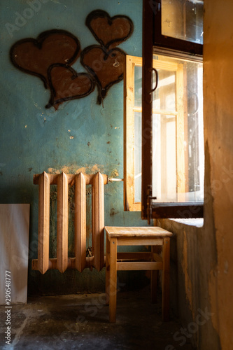 old chair in the room with warm light and hearts
