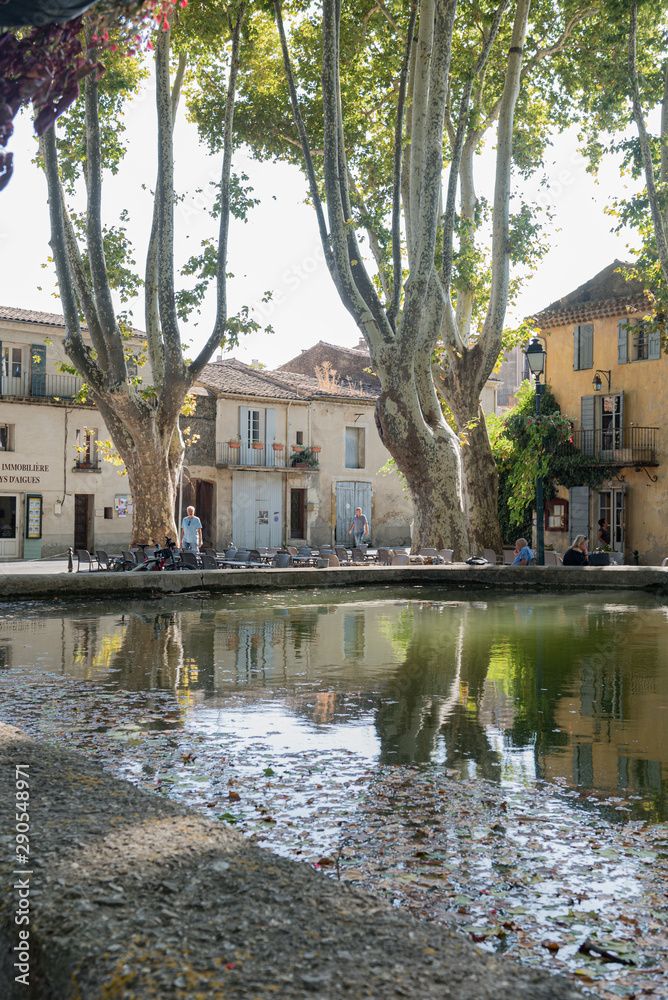 CUCURON, LUBERON, FRANCE - SEPTEMBER 25 : View on the Place de l'Etang in summer  in Cucuron, France, on September 25, 2018.