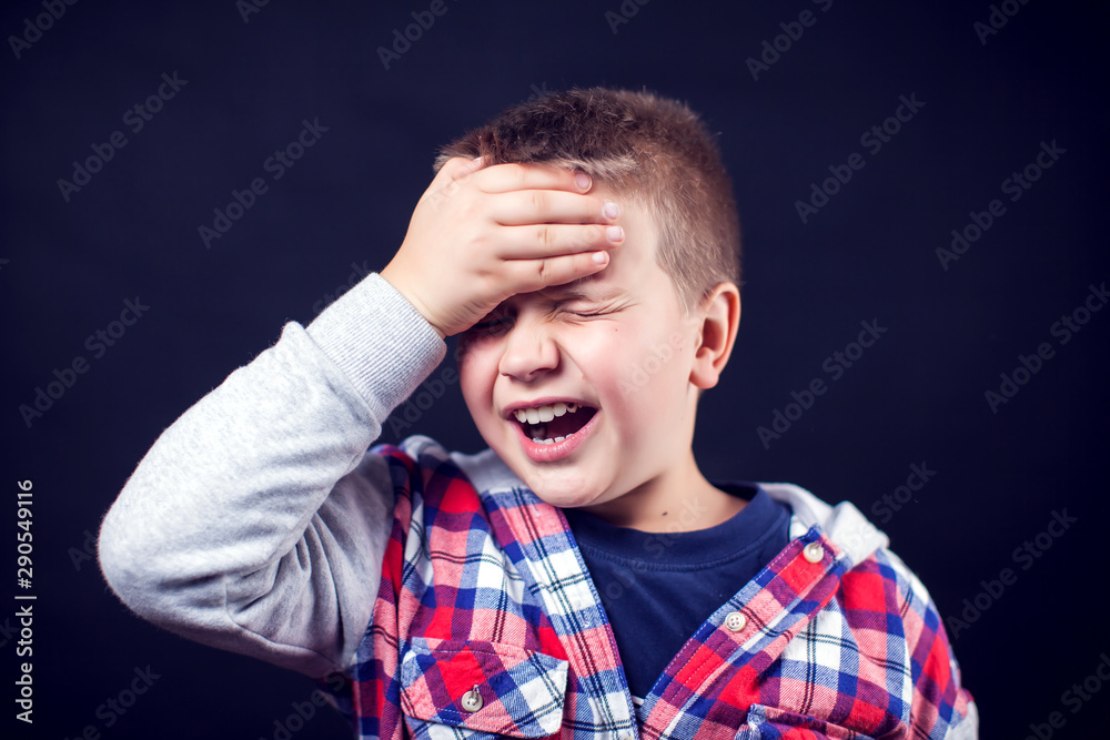 A boy with strong headache. Children, healthcare and medicine concept A boy with strong headache. Children, healthcare and medicine concept