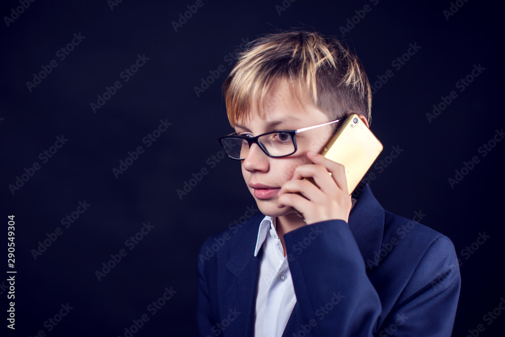 Young student with phone. Children and emotions concept