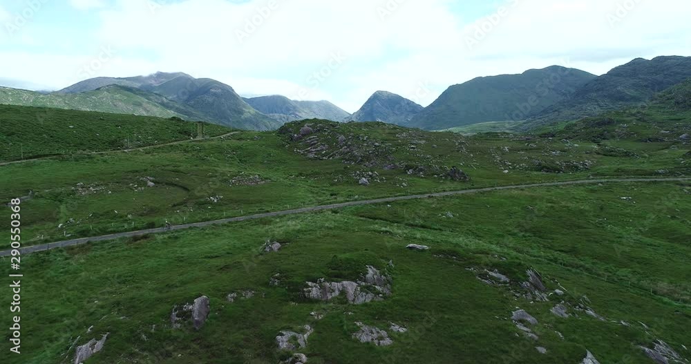 Wide aerial, rural road in Ireland mountains Wide aerial, rural road in Ireland mountains