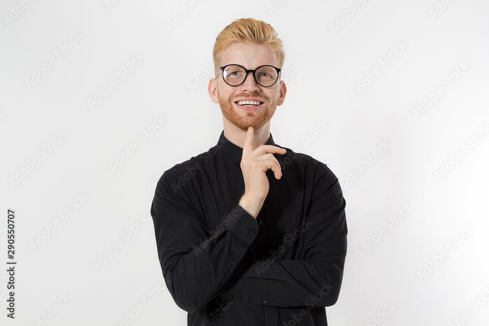 Happy Stylish guy in black shirt and glasses. Folded arms, copy space. Successful young, Entrepreneur concept. Redheaded man with red beard. Start up, young founder concept isolate on white background Happy Stylish guy in black shirt and glasses. Folded arms, copy space. Successful young, Entrepreneur concept. Redheaded man with red beard. Start up, young founder concept isolate on white background