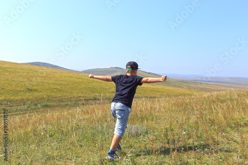 boy running in field