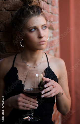 A beautiful woman with a glass of wine