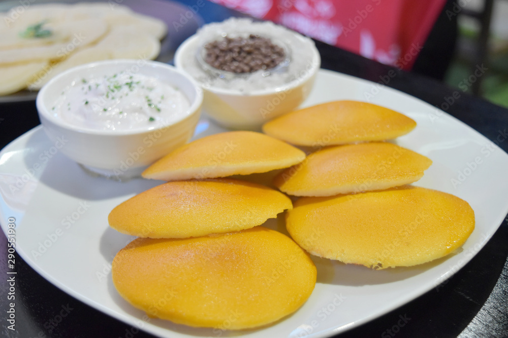 Sweet pancakes made from flour with sweet sauce on plate in restaurant. Sweet pancakes made from flour with sweet sauce on plate in restaurant.