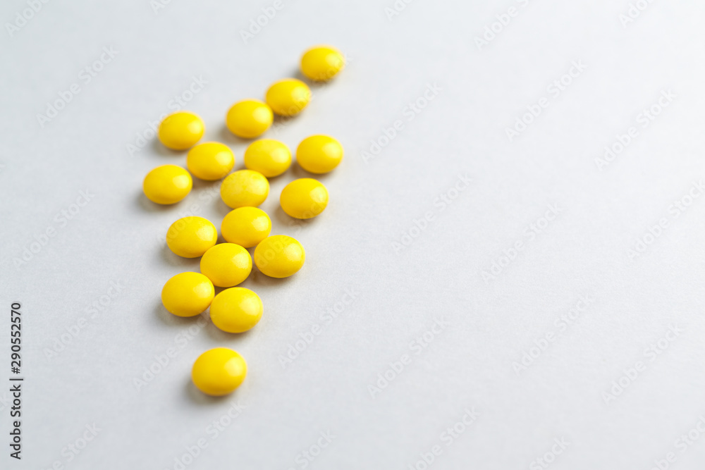 Vitamin C tablets. White background. Close up. Copy space. Vitamin C tablets. White background. Close up. Copy space.