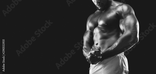 Young black athlete showing his muscular chest