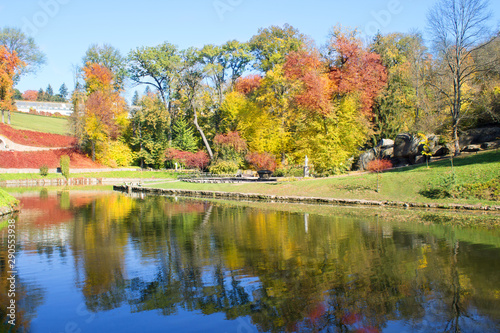 Autumn park and beautiful lake. Landscape background. Travel concept.