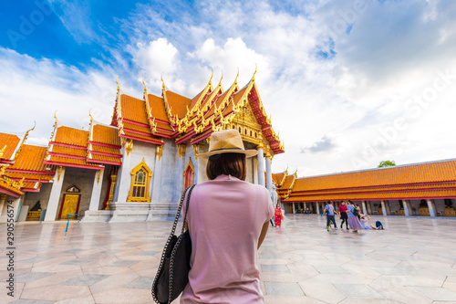 Photography Tourist women travel in buddhist marble temple  in Bangkok