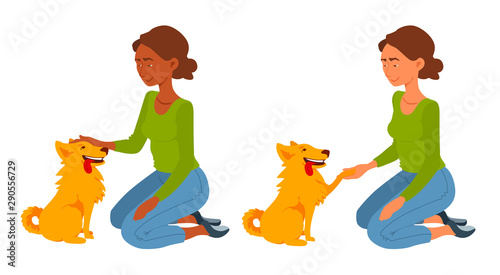 A young woman sits on her knees, pet the dog, holding its paw. Dog and lady look at each other.