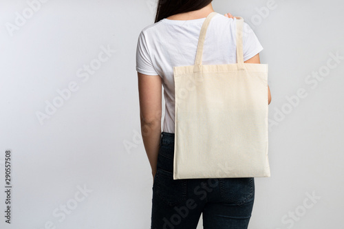 Girl Holding Eco Bag Standing Back To Camera On White