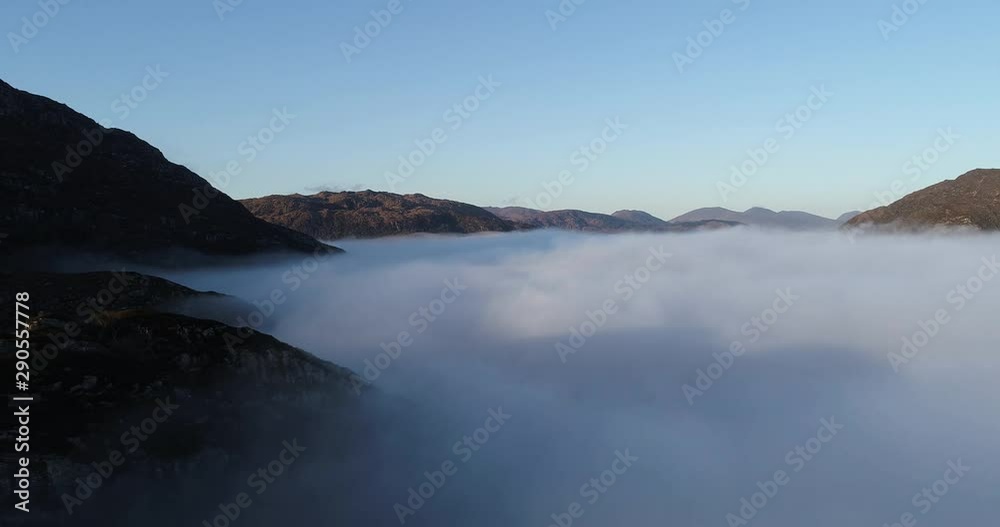 Dense fog in Killarney National Park mountains, aerial