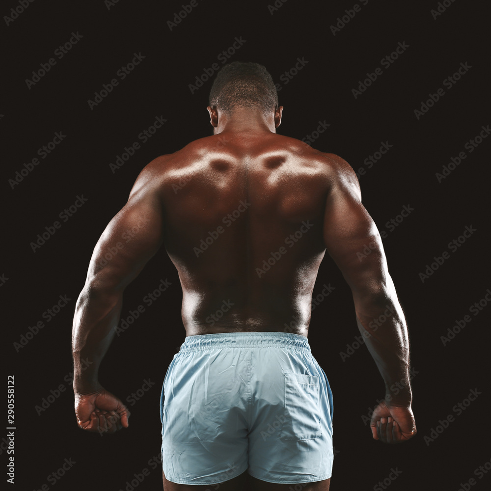 Fototapeta premium African american sportsman showing strong back muscles