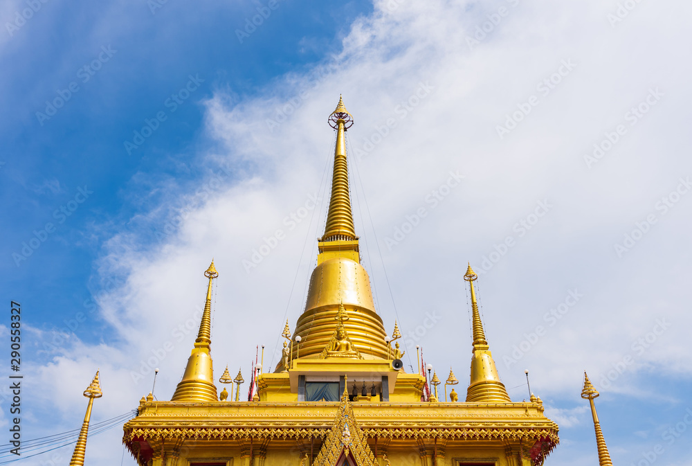The top of the golden pagoda in the blue sky. The top of the golden pagoda in the blue sky.