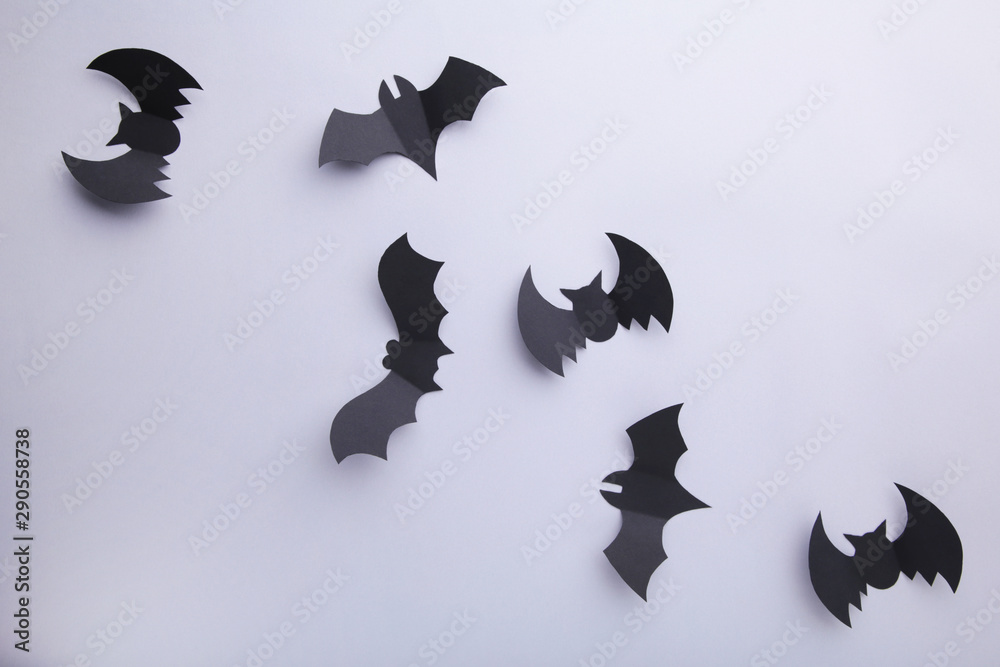Fototapeta premium Halloween paper bats on grey background. Halloween concept