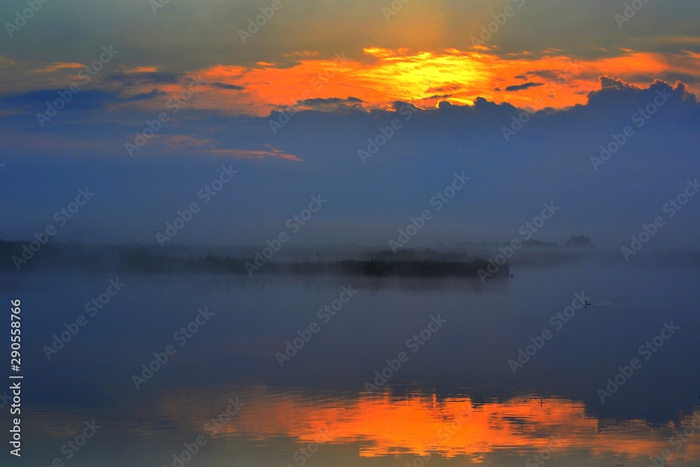 a sunrise at the lake