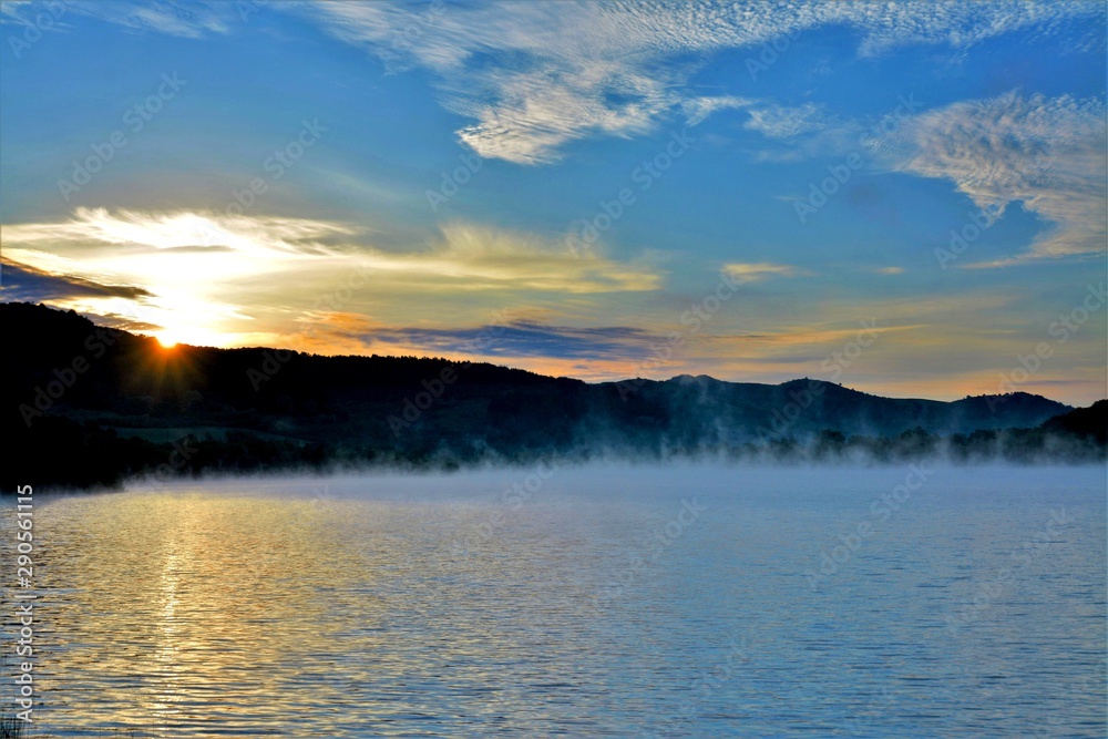 a sunrise at the lake