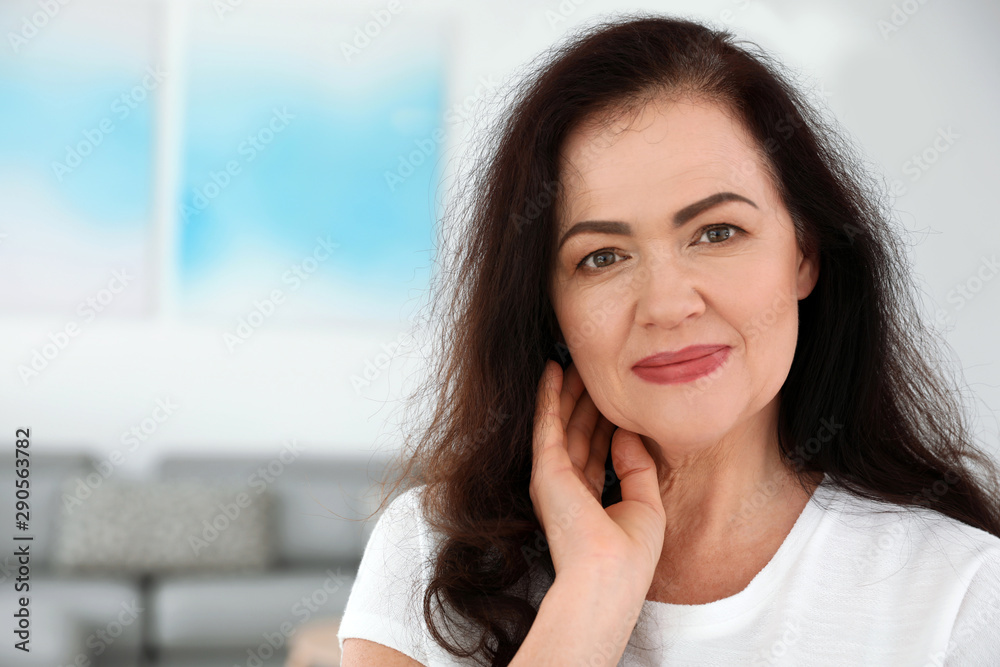 Portrait of mature woman with beautiful face indoors. Space for text Portrait of mature woman with beautiful face indoors. Space for text