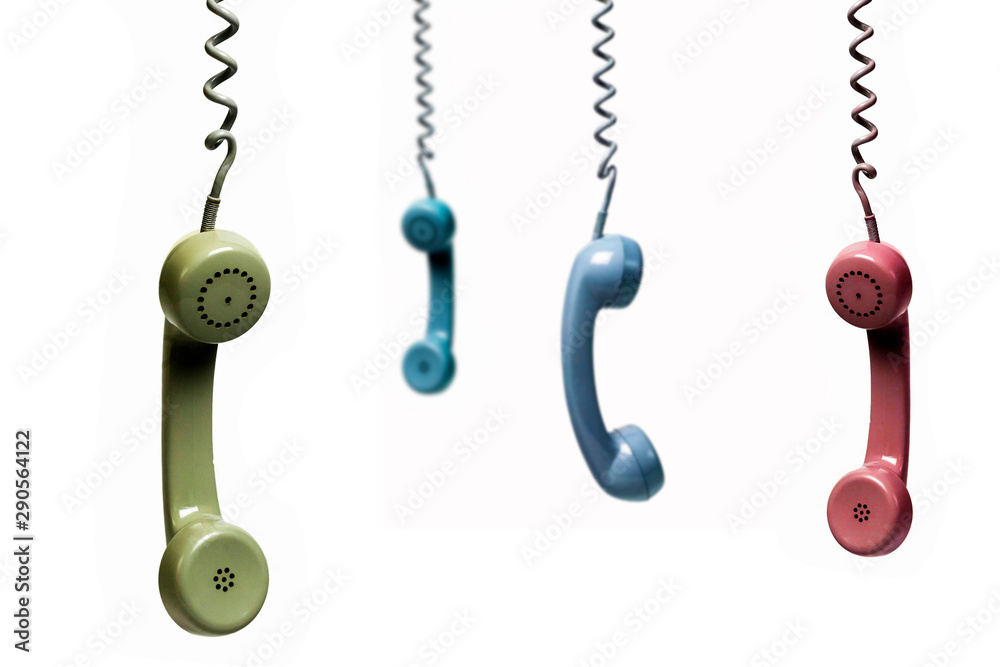 Four phones hanging from several colors isolated on a white background Four phones hanging from several colors isolated on a white background