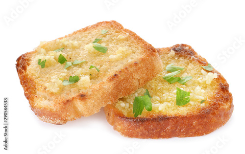 Slices of toasted bread with garlic and herb on white background