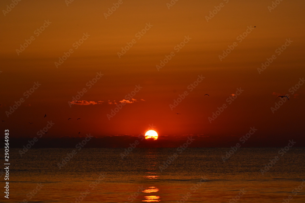 a beautiful sunrise at the seashore a beautiful sunrise at the seashore
