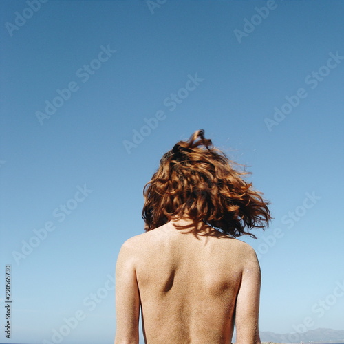 girl stand in sun photo