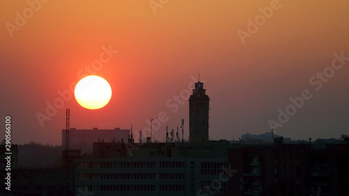 sunset on a background of city buildings