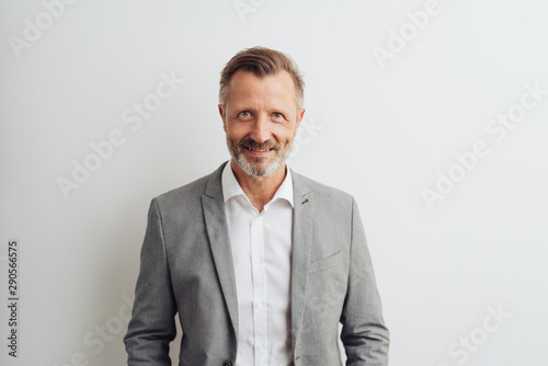 Smart middle-aged bearded man in grey jacket