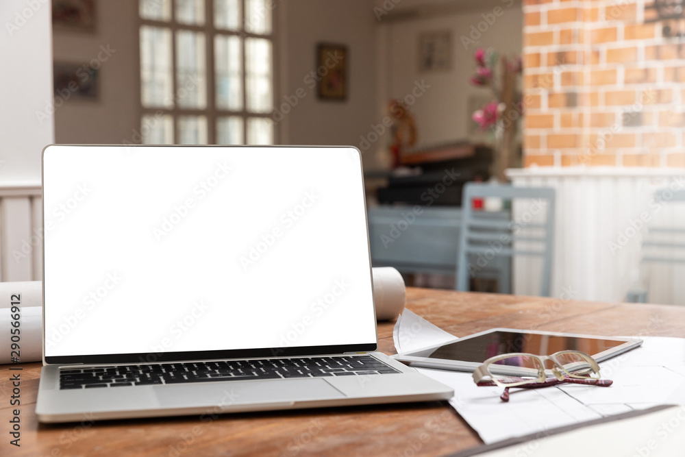 Laptop with tablet on architect desk. Business, architecture, building construction and technology concept. Laptop with tablet on architect desk. Business, architecture, building construction and technology concept.