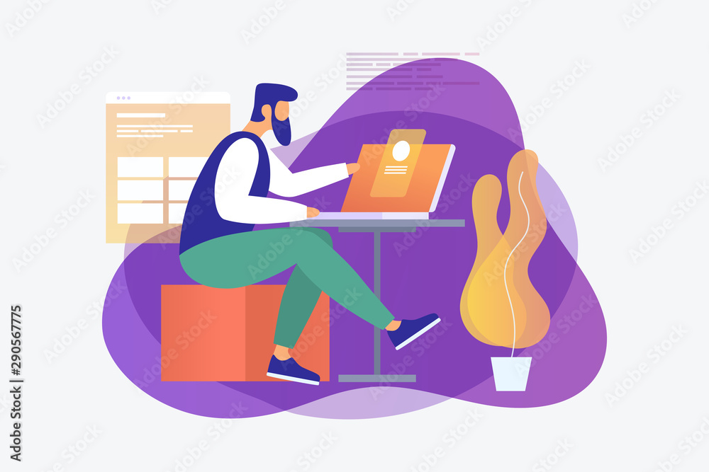 A young programmer is working on a project behind a laptop in the ...