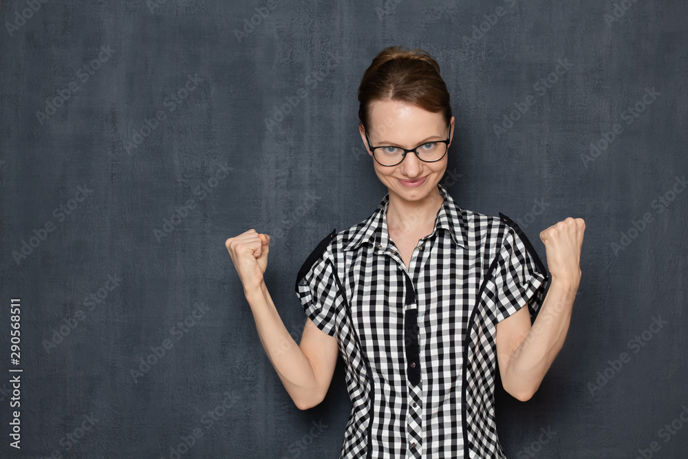 Portrait of excited satisfied showing yes gesture with fists Portrait of excited satisfied showing yes gesture with fists