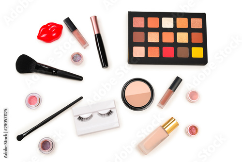 Professional makeup products with cosmetic beauty products, eye shadows, pigments, lipsticks, brushes and tools. Space for text or design.
