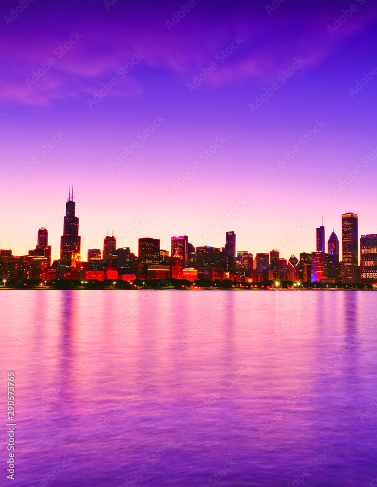 Fototapeta premium View of Chicago skyline from the shore of Lake Michigan at dusk.