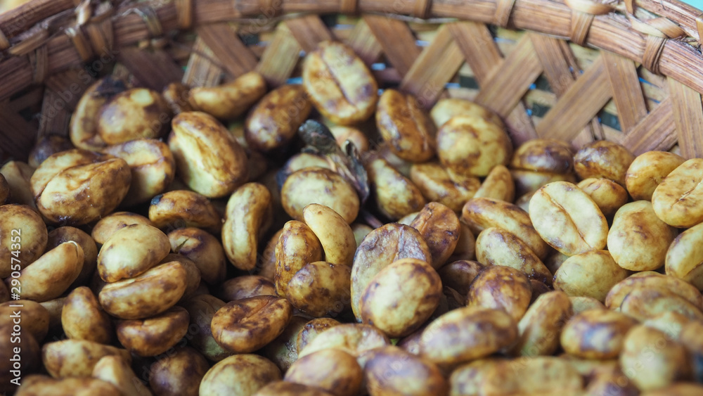 Closeup Shot of Honey Process Coffee Beans in A Bamboo Basket. Selective Focus, Blurred Foreground and Background. Closeup Shot of Honey Process Coffee Beans in A Bamboo Basket. Selective Focus, Blurred Foreground and Background.