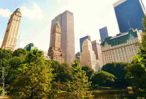 Central Park in New York the USA. Beautiful autumn picture of skyscrapers and trees.  photo