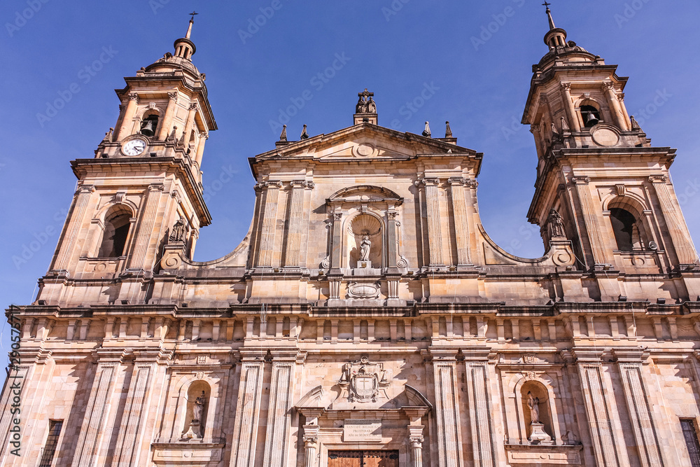 Facade of  The Primada Cathedral of Bogotá stands in the framework of the Plaza de Bolívar, in the center of the city. Bogota Colombia