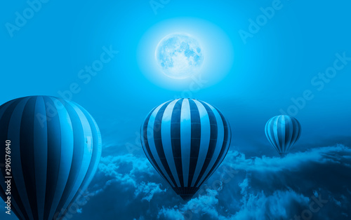 Night sky with moon in the clouds at sunset - Hot air balloon over the storm clouds "Elements of this image furnished by NASA