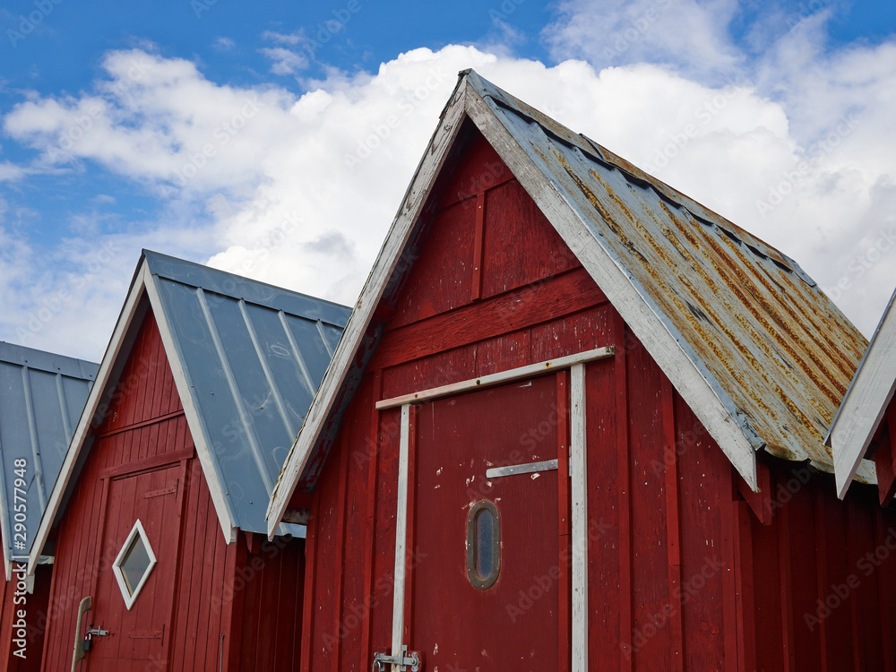 Beautiful red fishing huts on the coast