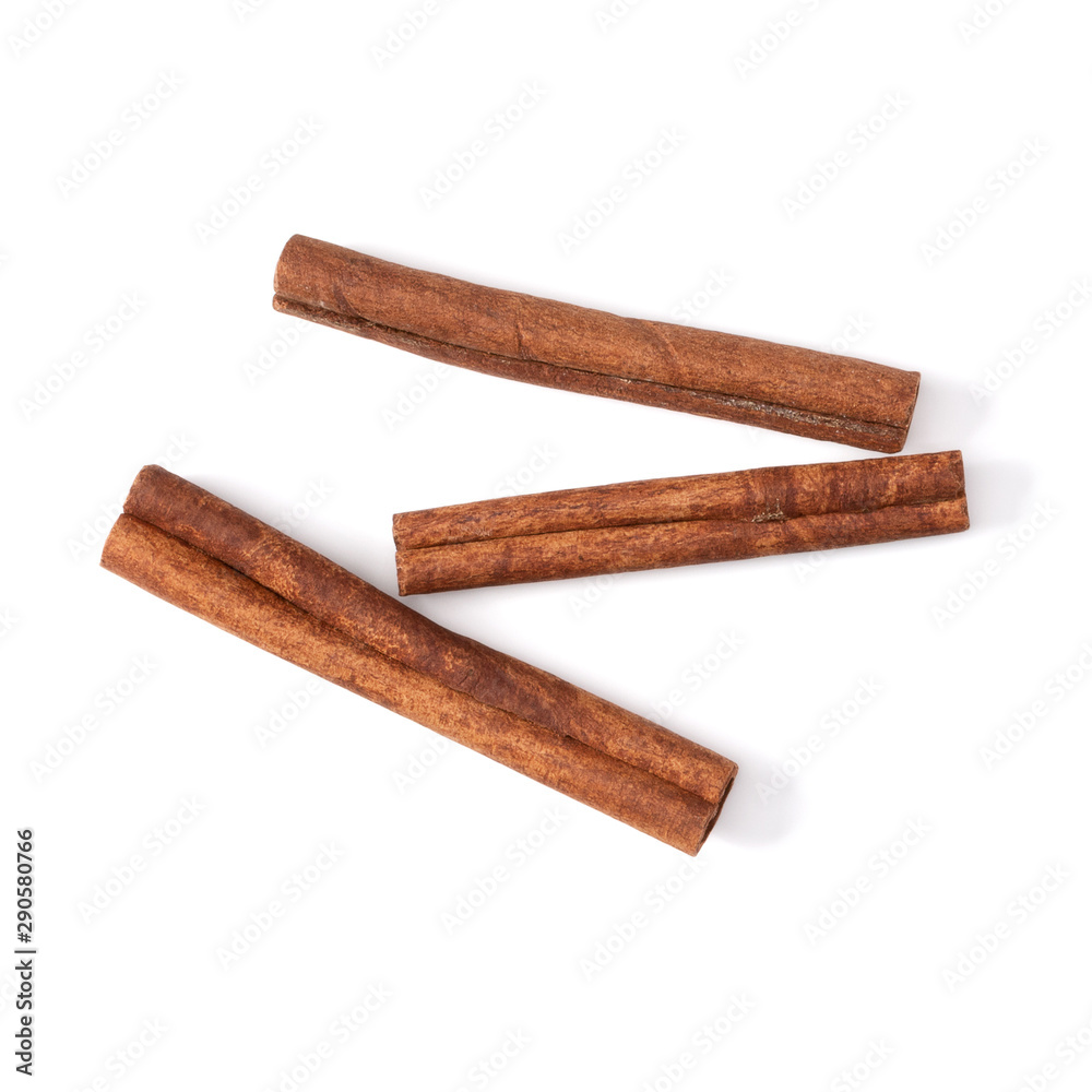 Cinnamon sticks isolated on white background closeup. Canella spice. Aromatic condiment background. Flat lay, top view. Cinnamon sticks isolated on white background closeup. Canella spice. Aromatic condiment background. Flat lay, top view.