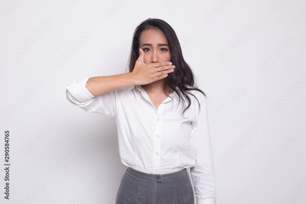 Young Asian woman close her mouth with hand. Young Asian woman close her mouth with hand.
