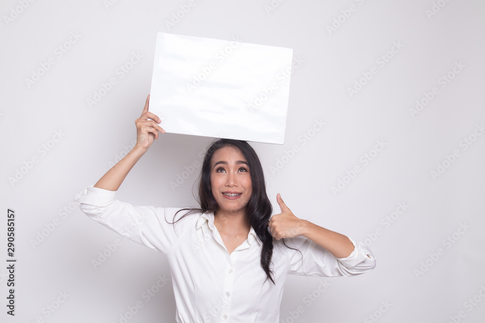 Young Asian woman show thumbs up with white blank sign. Young Asian woman show thumbs up with white blank sign.