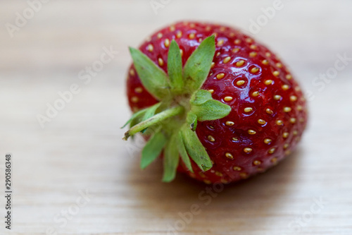 Fresh strawberry on wooden background photo