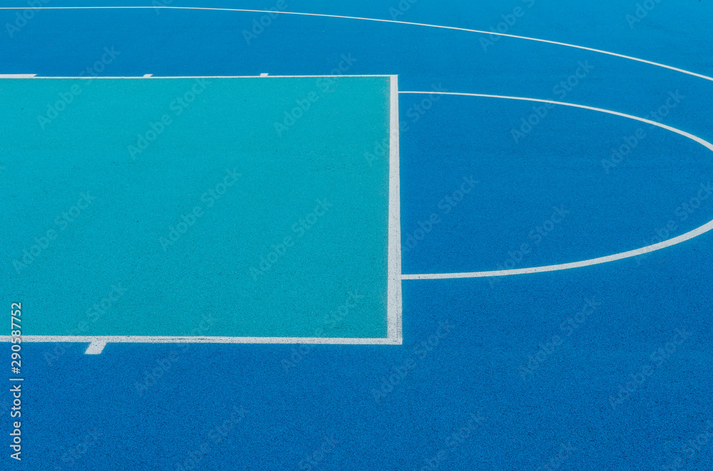 Abstract, blue background of newly made outdoor basketball court