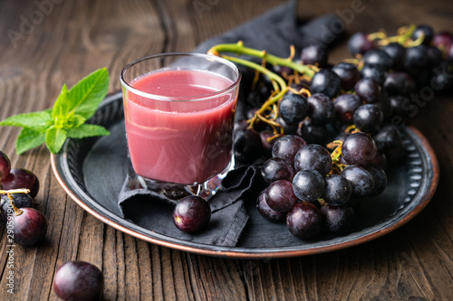 Seasonal homemade drink, freshly made grape juice in glass jar